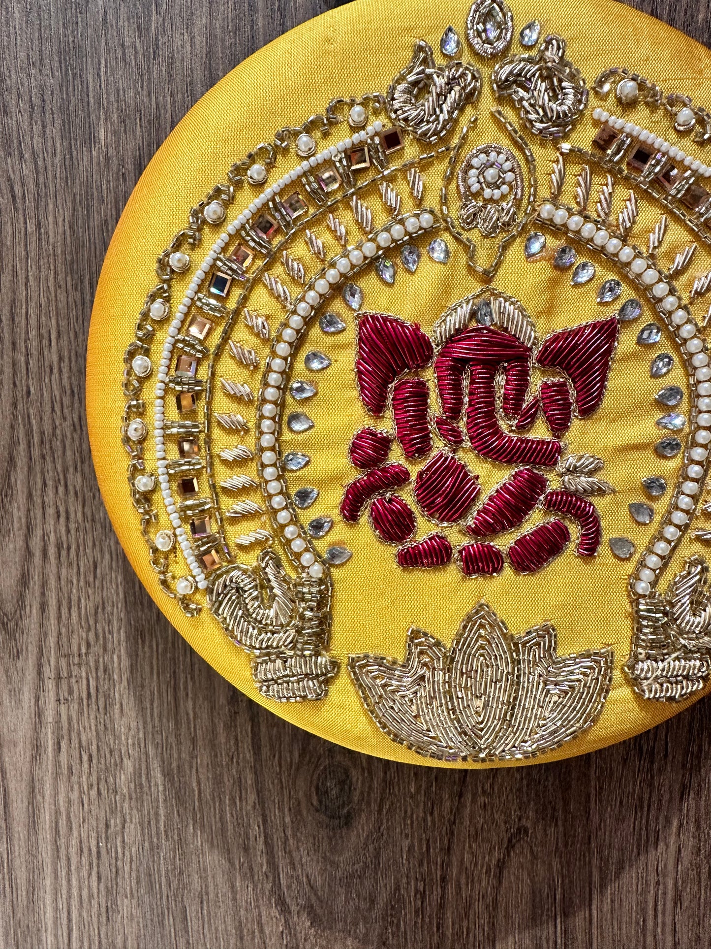 Yellow Ganesha Embroidered Diamond Studded Wristlet with Gold Sling Chain