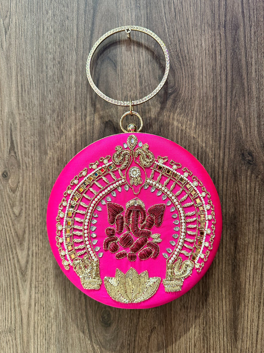 Shocking Pink Ganesha Embroidered Diamond Studded Wristlet with Gold Sling Chain